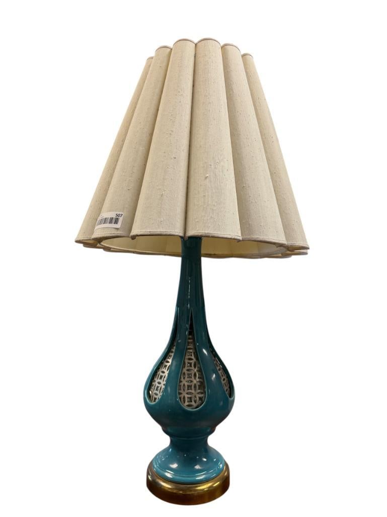 MID-CENTURY MODERN TURQUOISE GLAZE CERAMIC TABLE LAMP WITH GLASS BEAD FILLED BODY WITH METAL PANELS: TALL BULBOUS BODY WITH TEAR DROP SHAPE CUTOUT WINDOWS, CLEAR MARBLE FILLED WITH PIERCED METAL WINDOWS, WITH PLEATED SHADE, TESTED + 31" H