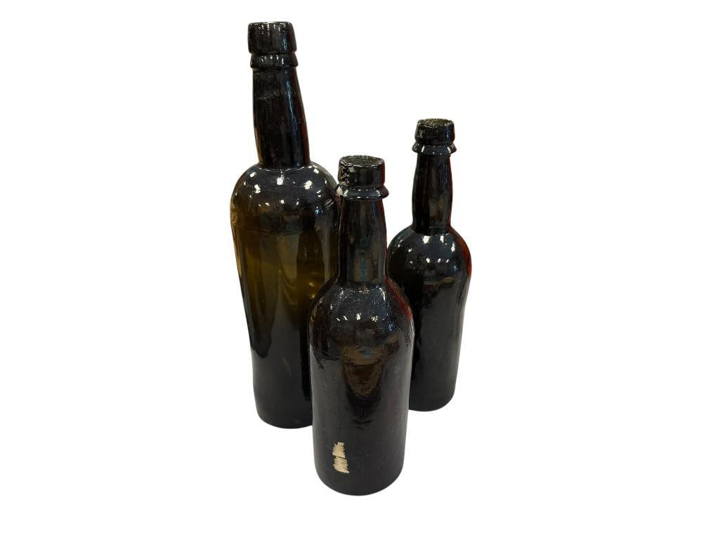THREE ANTIQUE OLIVE GREEN " BLACK GLASS " GLASS BEER BOTTLES (1 of 8)