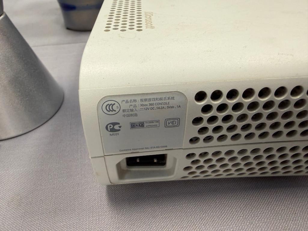 XBOX 360 GAME CONSOLE INCLUDES POWER CORDS, AV CORD, AND TWO CONTROLLERS - 8