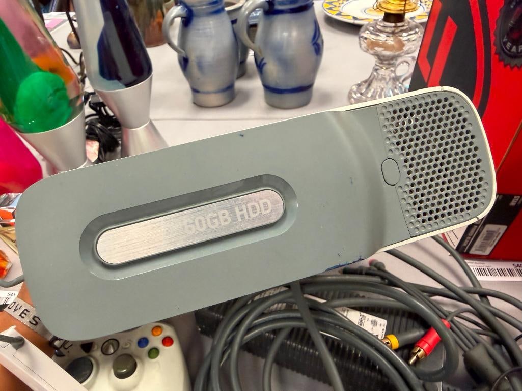 XBOX 360 GAME CONSOLE INCLUDES POWER CORDS, AV CORD, AND TWO CONTROLLERS - 9