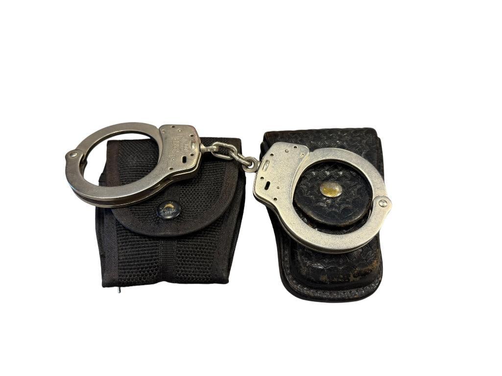 THREE SETS OF SMITH & WESSON HANDCUFFS WITH KEYS: INCLUDES NYLON AND LEATHER POUHES