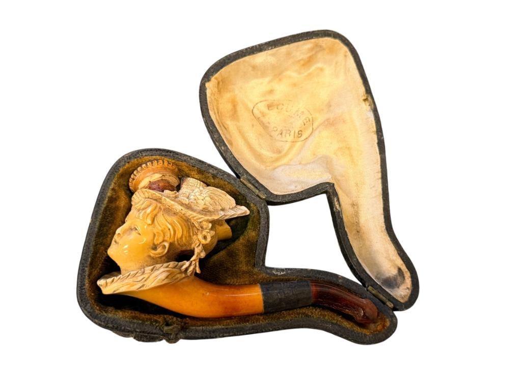 ANTIQUE FRENCH HAND CARVED MEERSCHAUM FIGURAL TOBACCO PIPE ECUME DE PARIS: SMALL CARVED MEERSCHAUM TOBACCO PIPE OF A WOMAN WITH A HAT, FEATURES A SILVER COLLAR WITH HALLMARK, REMOVABLE BOWL, WITH ORIGINAL LEATHER WRAPPED CASE, NARKED ON THE FABRIC ECUME DE PARIS, TOBACCO PIP