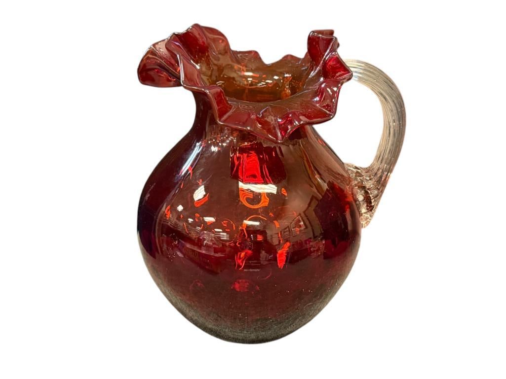 AMBERINA FENTON RUFFLED RIM "FENTON" THUMBPRINT PITCHER HAND BLOWN ART GLASS: BULBOUS PITCHER WITH RUFFLED RIM AND APPLIED CLEAR HANDLE, NO CHIPS OR CRACKS 9" H