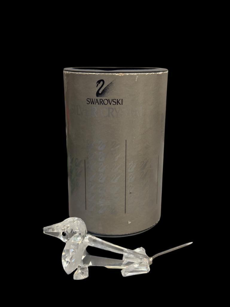 SWAROVSKI CRYSTAL DACHSCHUND (LARGE) INTRODUCED IN 1984 DESIGNED BY MAX SCHRECK RETIRED 1991: CRYSTAL BODY WITH METAL TAIL, IN MINT CONDITION WITH ORIGINAL TUBE AND CERTIFICATE, NO CHIPS OR REPAIR 4" L