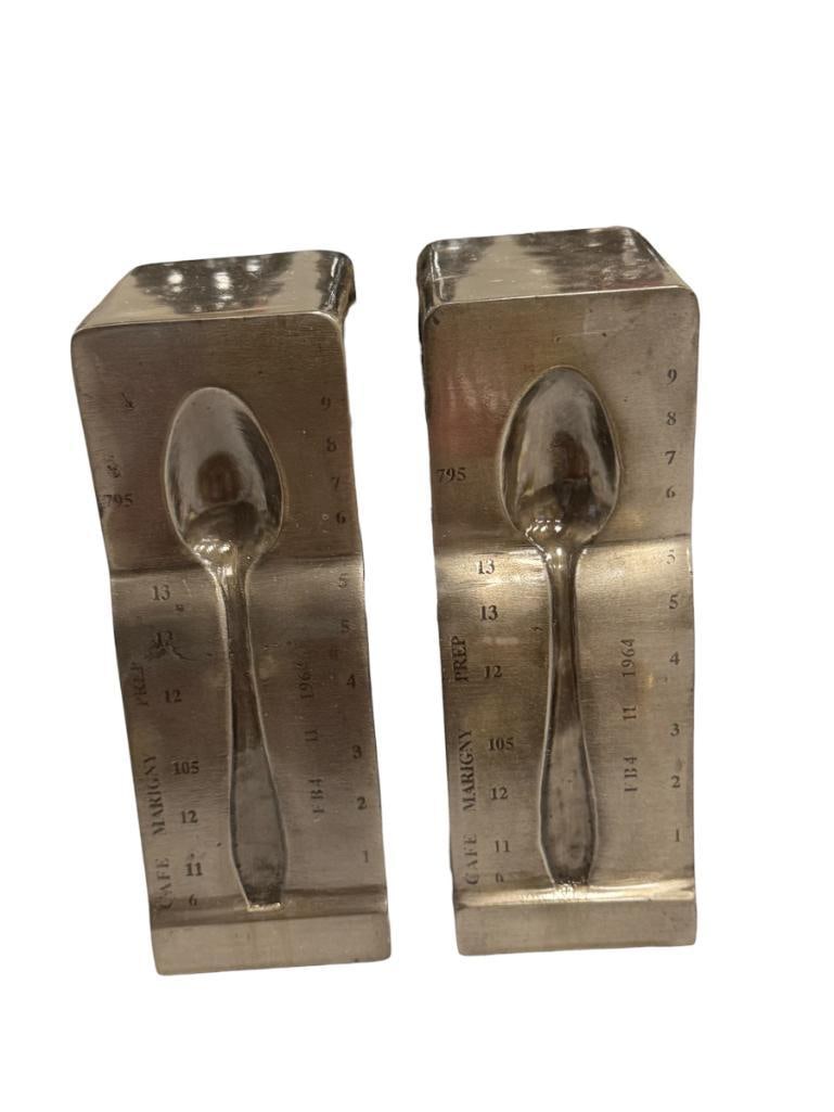 HARDWARE RESTORATION INDUSTRIAL STYLED SPOON BOOKENDS: STAINLESS STEEL FINISH BOOKENDS REPRESENTING ANTIQUE SPOON, FELT LINED BOTTOM, MADE IN INDIA 7" H