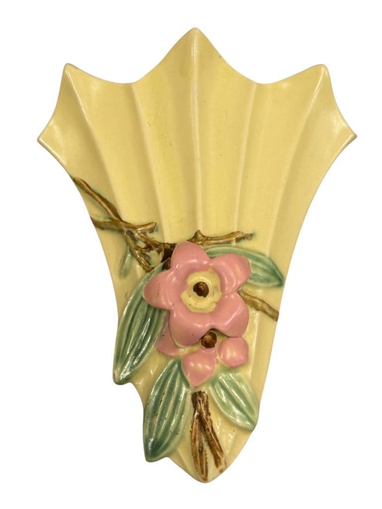 CIRCA 1940'S MCCOY POTTERY STYLIZED FAN-SHAPED WALL POCKET FROM BLOSSOMTIE LINE: MATTE YELLOW WITH FLORAL DECORATION, MARKED MCCOY ON THE BACK, NO CHIPS OR CRACKS 7 1/2" H