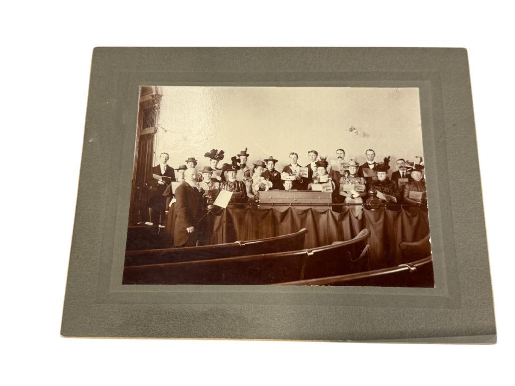 1900'S BLACK AND WHITE PHOTOGRAPH THE FIRST PRESBYTERIAN CHURCH PHILHARMONIC PETALUMA, CA: PHOTO DEPICTS SCENE OF MEN AND WOMEN POSING FROM THE PHILHARMONIC SOCIETY IN PETALUMA, CA, HAND WRITTEN INFORMATION ON THE BACK 9" X 6 3/4" 
