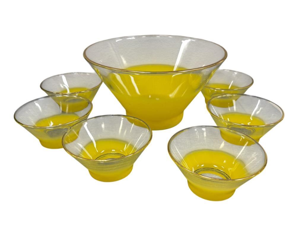 MID-CENTURY MODERN BLENDO FROSTED YELLOW OMBRE SERVING BOWL SET: SEVEN PIECE SALAD BOWL SERVING SET, CLEAR TO FROSTED YELLOW WITH GILT EDGE RIM, ONE INDIVIDUAL BOWL HAS A CHIP ON THE EDGE 5" AND 10 1/2" BOWLS