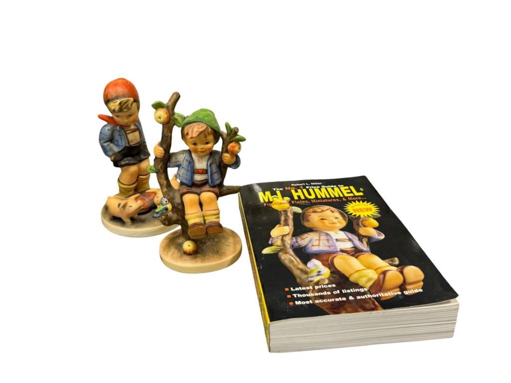 GOEBEL HUMMEL FIGURINES APPLE TREE BOY #142/I TMK 6 AND FARM BOY NO. 66 TMK 2: FARM BOY FIGURINE HAS A CHIP ON ONE OF THE PIGS TAIL, PLUS ROBERT L . MILLER M.I. HUMMEL GUIDE BOOK 5 1/8" AND 5 3/4" H