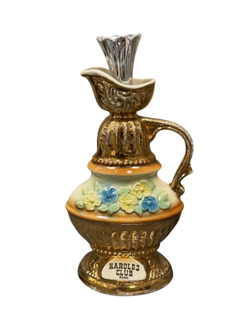HAROLDS CLUB RENO, NV DECANTER BY REGAL CHINA FOR BEAM DISTILLING CO.: TALL GILT DECORATED DECANTER WITH FLORAL DESIGN IN RELIEF, EMPTY 12 1/4" H
