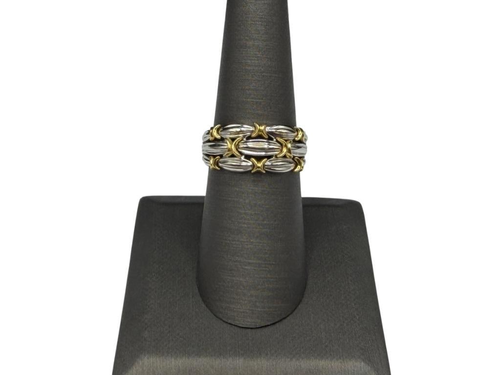 18K TWO-TONE GOLD FASHION RING FEATURING WHITE GOLD BANDS ACCENTED WITH YELLOW GOLD RIBBONS: MARKED "P18K" FOR 18K PLUMB SIZE 7 1/4, 3/8" FRONT, 4.84 GRAMS
