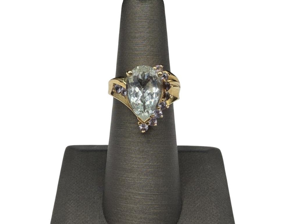SAMUEL AARON INC. DESIGNER SIGNED 14K YELLOW GOLD PEAR CUT AQUAMARINE AND TANZANITE FASHION RING: FEATURING A PEAR CUT AQUAMARINE ACCENTED BY 10 ROUND CUT TANZANITES, DESIGNER HALLMARKED "THL" SIZE 6, 3/4" FRONT, 4.93 GRAMS, APPROX. 4.0CT AQUAMARINE, .75CTTW TANZANITES