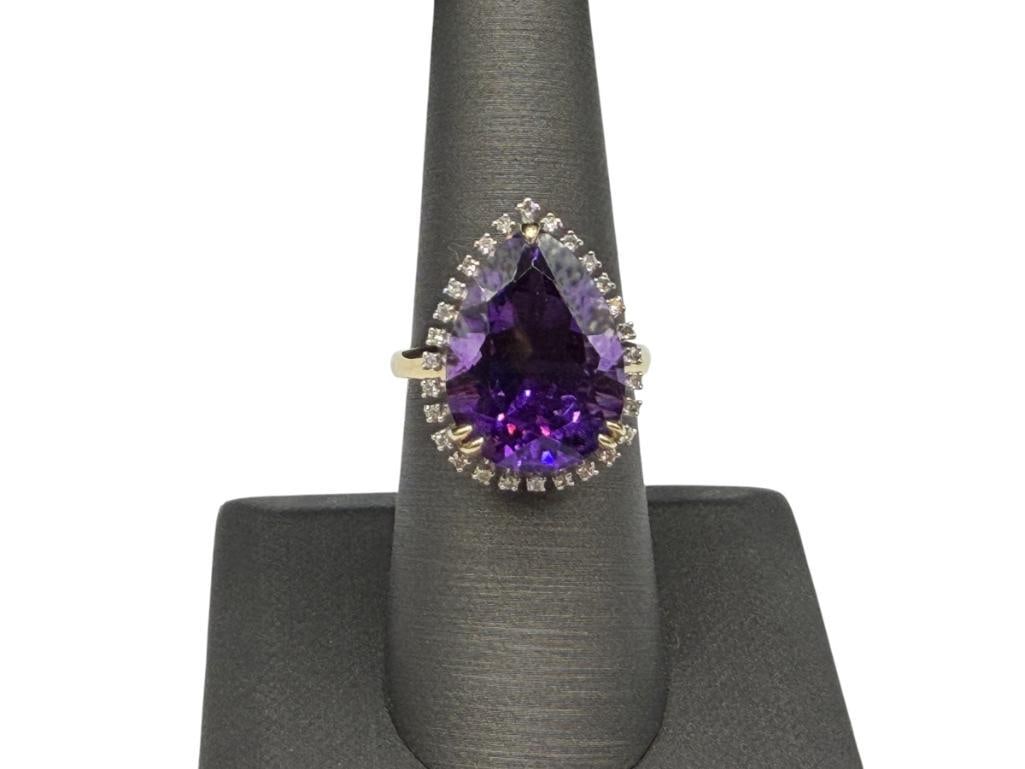 14K YELLOW GOLD PEAR CUT AMETHYST AND ROUND BRILLIANT CUT DIAMOND COCKTAIL FASHION RING: FEATURING A STUNNING PEAR CUT AMETHYST ACCENTED BY 32 ROUND BRILLIANT CUT DIAMONDS SIZE 7 1/4, 7/8" FRONT, APPROX. 10CT AMETHYST, .16CTTW DIAMONDS, 5.21 GRAMS