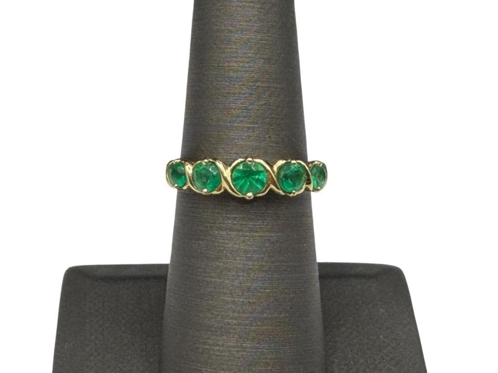 HONG KONG JEWELRY DESIGNER SIGNED 14K YELLOW GOLD ROUND CUT EMERALD RING: FEATURING FIVE ROUND CUT EMERALDS RANGING IN SIZE, MARKED "HONG KONG" SIZE 6 1/4, APPROX. .75CTTW EMERALDS, 3/16" FRONT, 2.50 GRAMS
