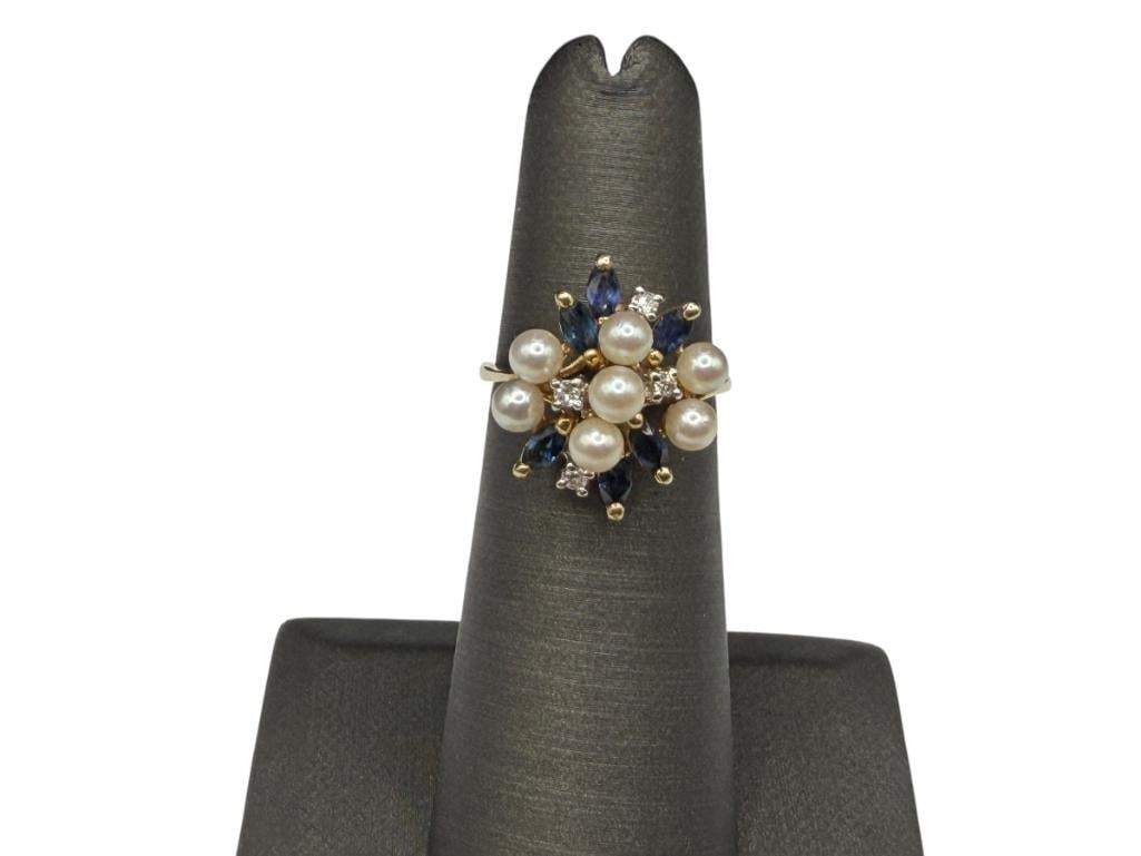 14K YELLOW GOLD BLUE SAPPHIRE, DIAMOND, AND PEARL CLUSTER FASHION RINGSIX MARQUISE CUT BLUE SAPPH...: FEATURING SIX MARQUISE CUT BLUE SAPPHIRES, FOUR ROUND BRILLIANT CUT DIAMONDS, AND SEVEN PEARLS SIZE 4 3/4, 5/8" FRONT, 3.39 GRAMS, 3.5MM PEARLS, 3MM SAPPHIRES, 1MM DIAMONDS