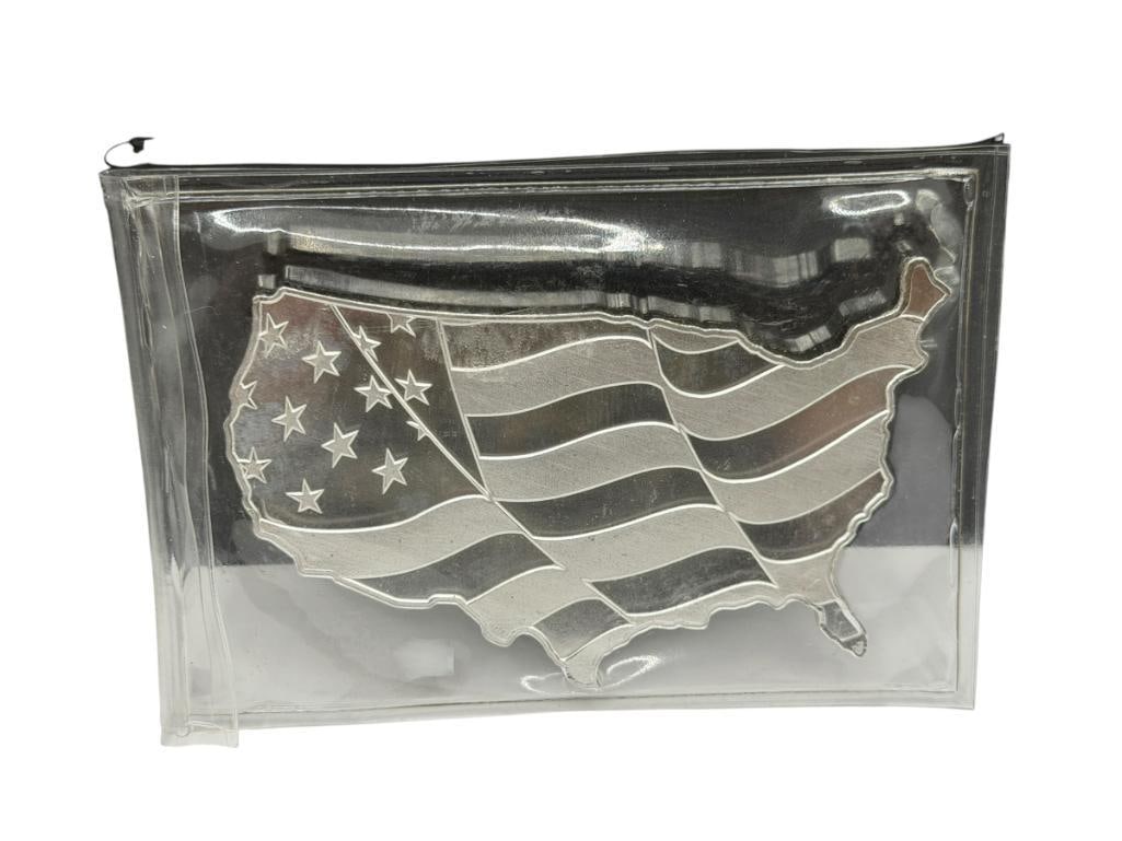 FIVE TROY OUNCE .999 FINE SILVER FIGURAL U.S.A. ART BAR BY ELEMETAL: FEATURES SHAPE OF U.S.A. AND FLAG IN RELIEF, ELEMETAL DESIGN ON BACK 5 TROY OUNCES, 3 3/4"
