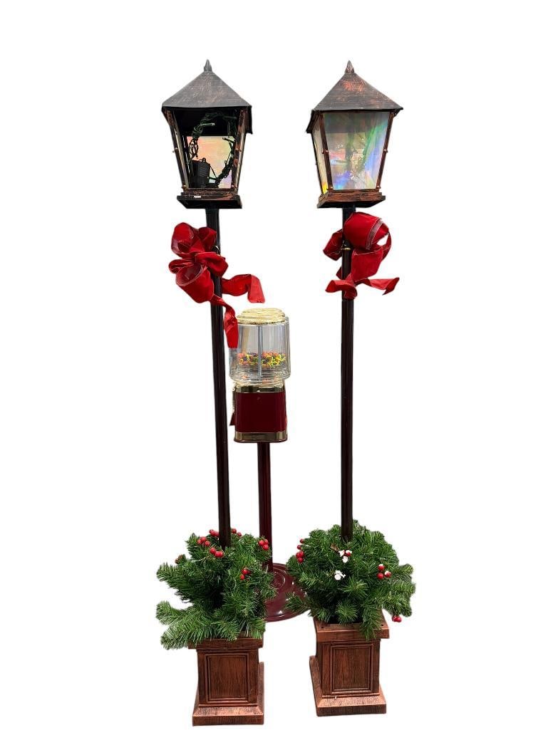 PAIR OF DECORATIVE HOLIDAY LAMP POST FEATURES WITH GREENERY: PRE LIT LAMP POST DECORATIONS, TOP LIGHTS FUNCTIONAL, BOTTOM LIGHT MAY NEED NEW BATTERIES, MISSING TWO PANELS 63" H