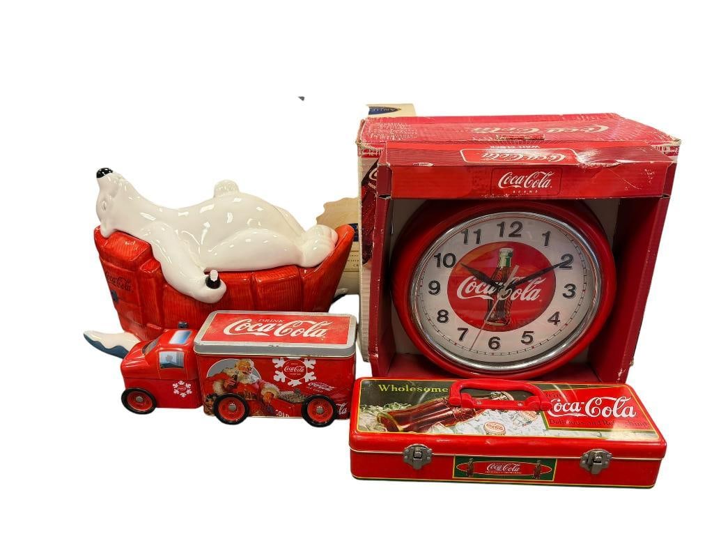 COCA-COLA COLLECTIBLES DINNERWARE SET, WALL CLOCK, COOKIE JAR, TIN CONTAINERS: TIN CONTAINERS INCLUDES MINIATURE COCA-COLA FIGURINES AND CUPS, DINNERWARE SET IS IN THE ORIGINAL BOX ALONG WITH CLOCK, COOKIE JAR HAS DAMAGE ON THE COKE BOTTLE