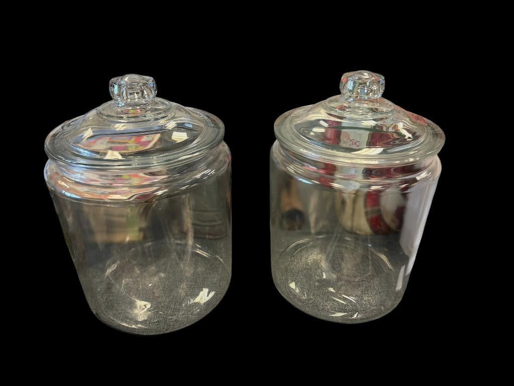 TWO LARGE GLASS JARS WITH LIDS: LARGE GLASS JARS USED FOR DRY GOODS, CRAFTS, ETC. NO CHIPS OR CRACKS 10 1/2" H, 8 3/4" ROUND