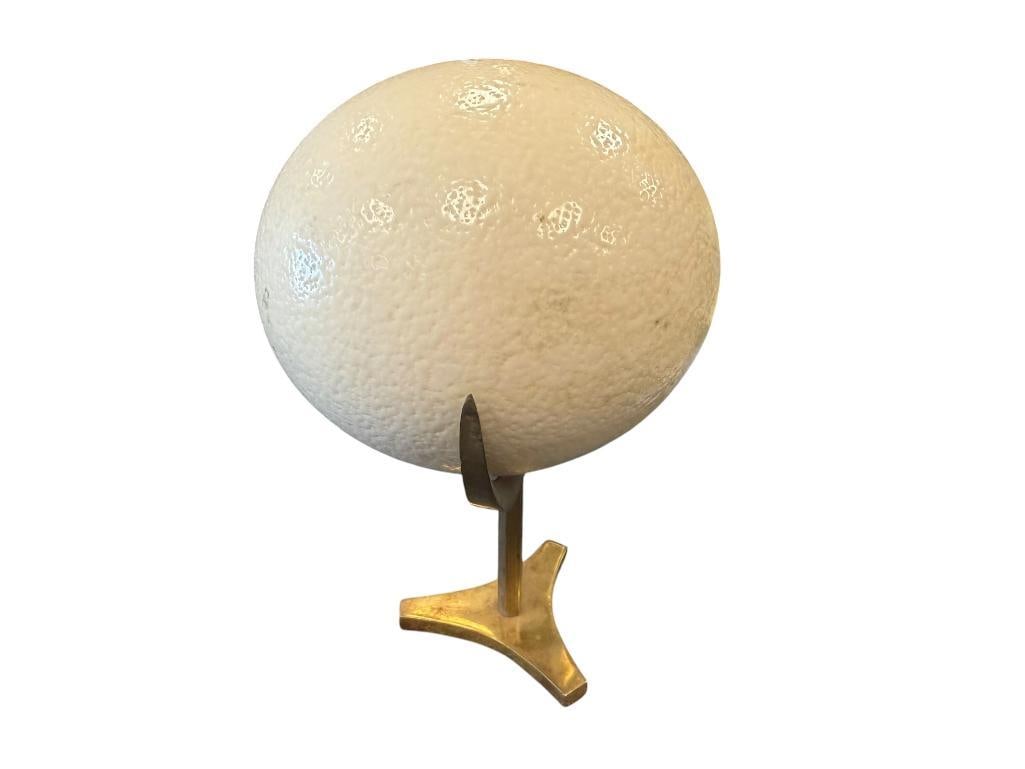 LARGE OSTRICH EGG WITH BRASS THREE ARM STAND: 9 1/2" OVERALL H