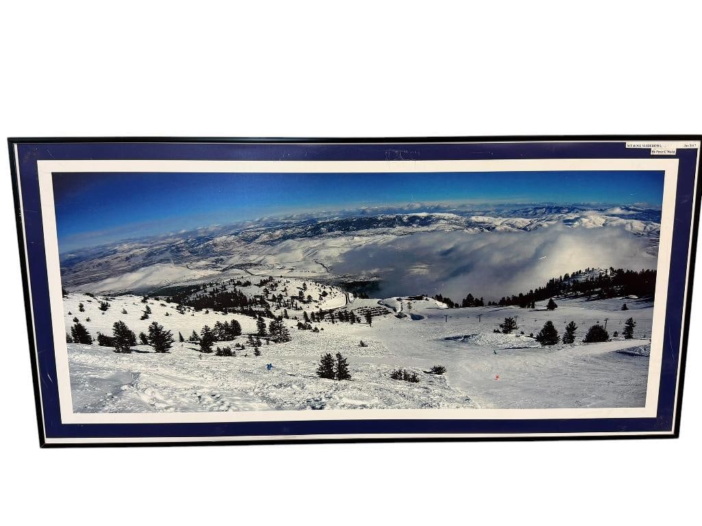 PETER C. WARD RENO, NV PHOTOGRAPHER COLOR PHOTOGRAPH ON BOARD TITLED MT. ROSE SLIDEBOWL JAN 2017: PHOTO DEPICTS SCENE ON MT. ROSE OF SKIER WITH PANORAMIC VIEW OF THE SIERRA NEVADA MOUNTAINS, SIGNED ON THE BACK, FRAMED 30" X 14 1/4" FRAME