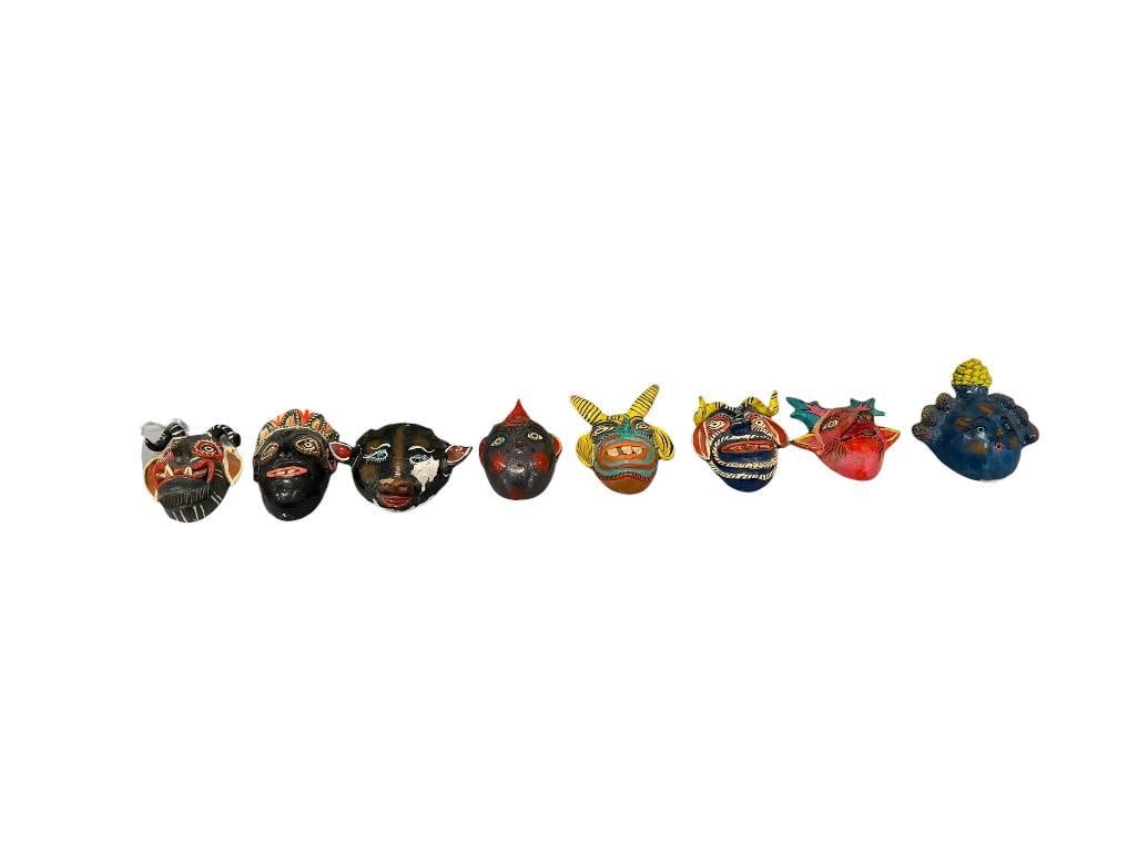 EIGHT MEXICAN FOLK ART TERRACOTA AND GOURD HAND CRAFTED MASKS INCLUDING SEVERAL DIABLO MASKS: INCLUDES FOUR HORNED CREATURES, FEW WITH LARGE PROTRUDING TEETH, EACH IS HAND CRAFT / PAINTED, FEW HAVE BEEN PREVIOUSLY REPAIRED OR HAVE SOME DAMAGE 5" UP TO 6" H