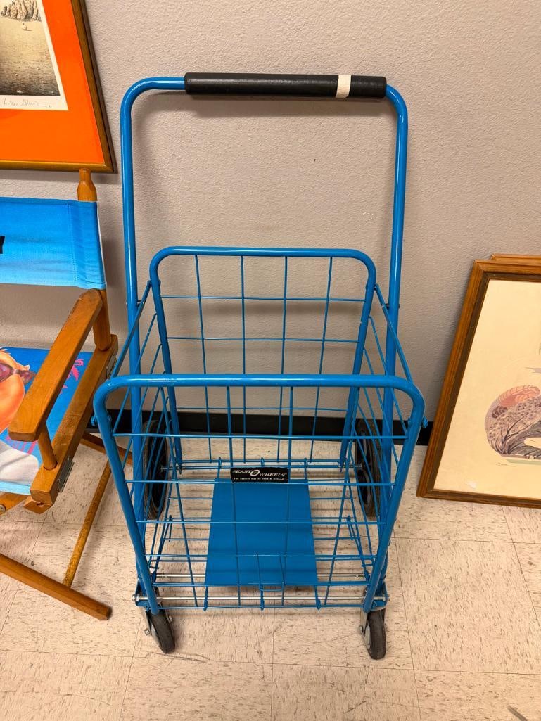 BLUE FOLDING METAL UTILITY CART FEATURING DEEP WIRE BASKET AND FRONT SWIVEL WHEELS - 2