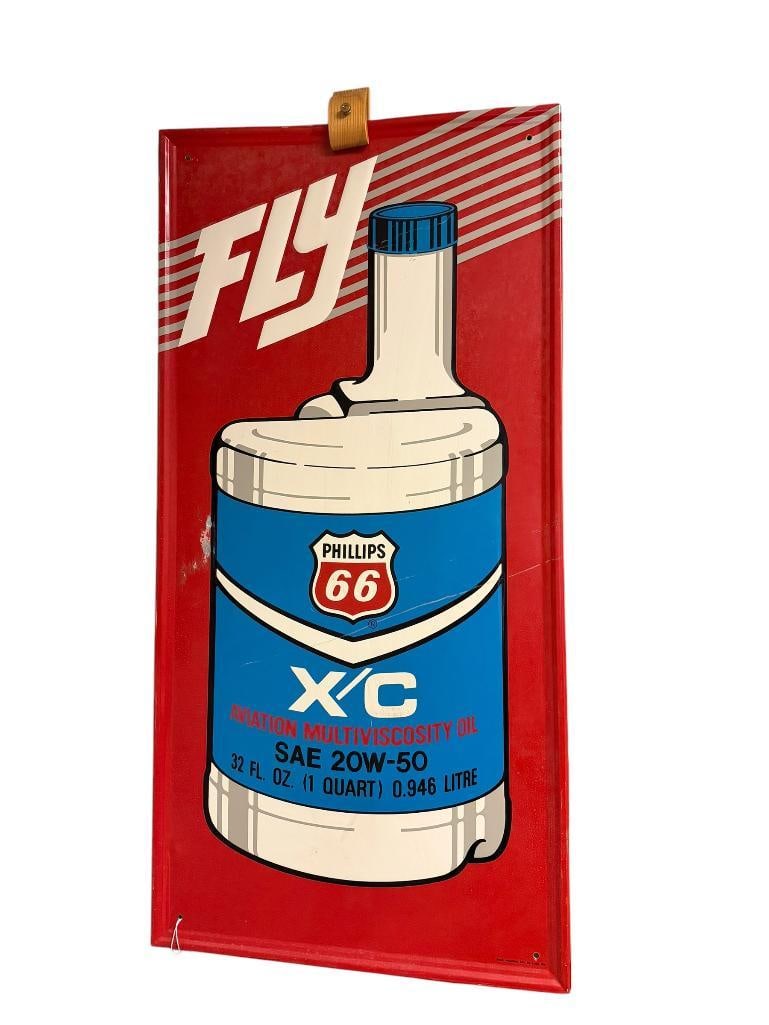 VINTAGE STUART INDUSTRIES INC. PHILLIPS 66 X/C AVIATION MULTIVISCOSITY SAE 20W-50 OIL METAL SIGN: METAL ADVERTISING SIGN, RETRO COLORS, "FLY," SINGLE SIDED, MADE BY STUART INDUSTRIES INC., IN PRETTY GOOD CONDITION WITH SOME MINOR SCUFFS, HAS HOLES NEAR CORNERS FROM MOUNTING 17 1/2" X 35 1/2"