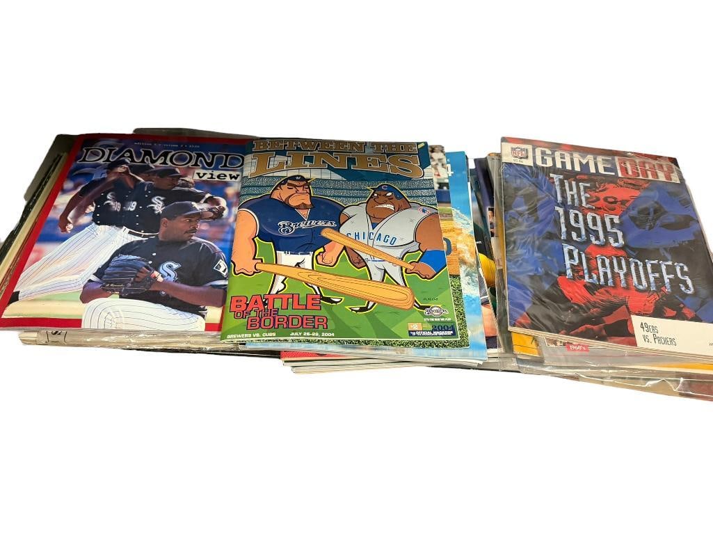 ASSORTED SPORTS PROGRAMS AND MAGAZINES DATING BACK TO THE 1970'S: INCLUDES OLYMPIC MICHAEL PHELPS, 1995 49ERS VS. PACKERS JANUARY 6, 1996 PLAYOFF GAME, 1990 WORLD SERIES "THE TRADING CONTINUES," AND MORE