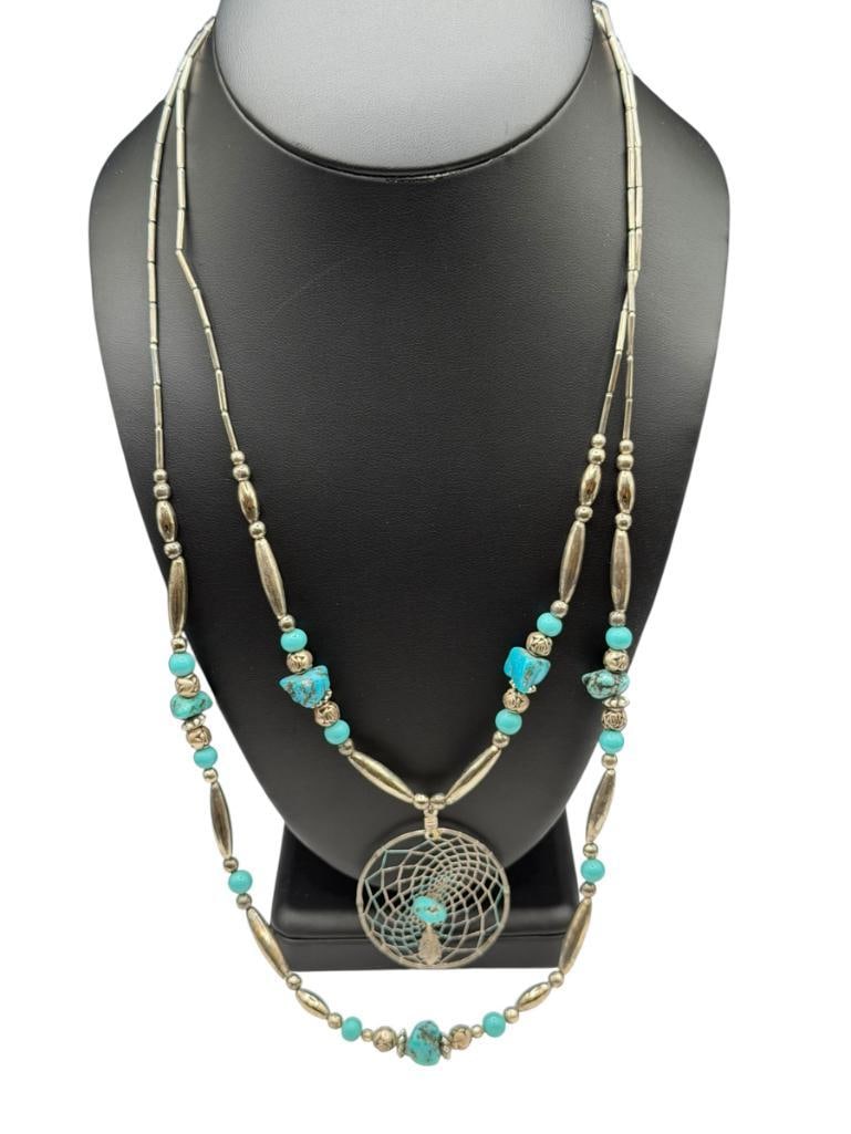 VINTAGE SOUTHWESTERN STYLE SILVERPLATED NECKLACE FEATURING DOUBLE STRAND AND DREAMCATCHER PENDANT: ACCENTED WITH TURQUOISE BEADS, BARREL CLASP LARGEST STRAND IS 25", 1 7/8" PENDANT