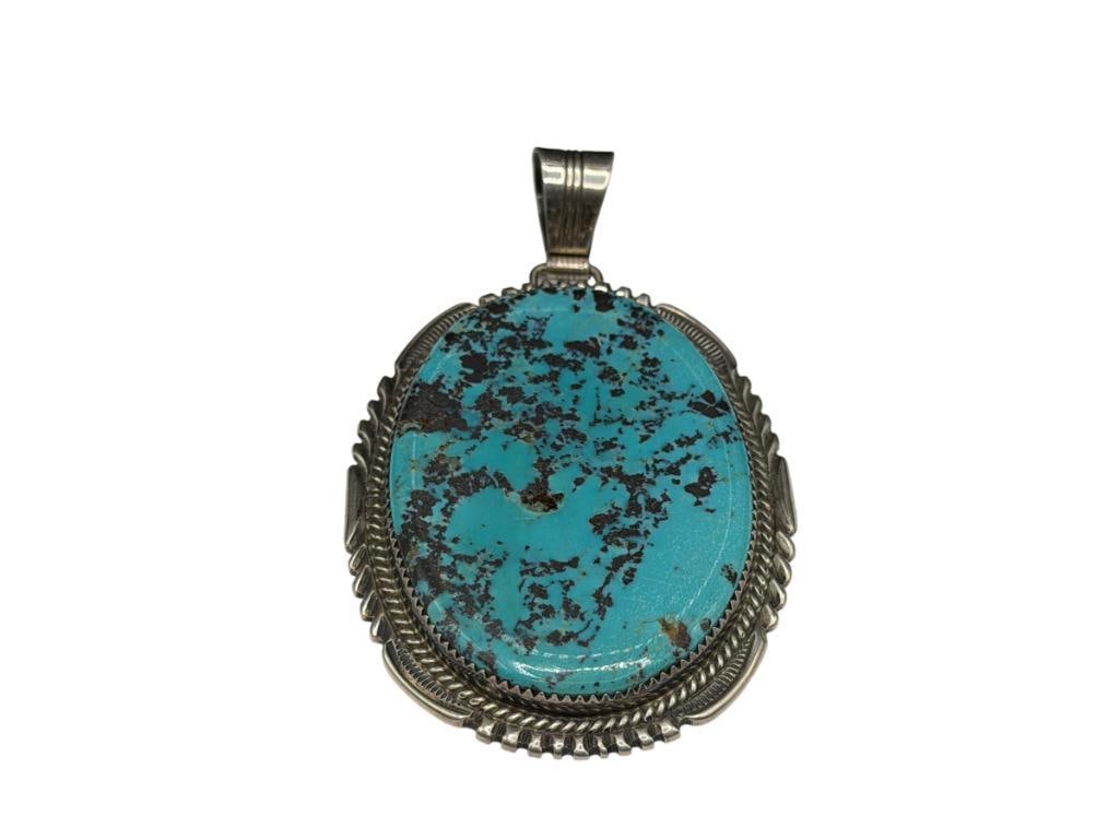 VINTAGE NAVAJO LOREN THOMAS BEGAY ARTIST SIGNED TURQUOISE PENDANT: FEATURING MATRIX RICH TURQUOISE WITH SMALL CHIP IN CENTER, SIGNED BY ARTIST "LTB" 3 1/4", 38.78 GRAMS