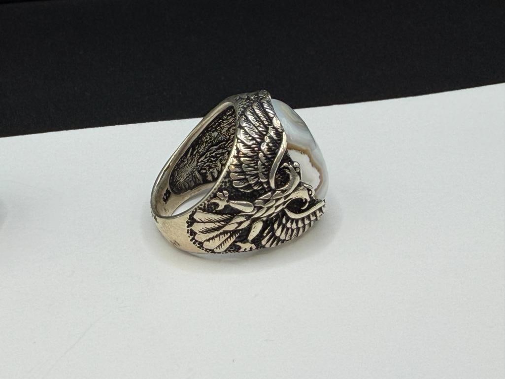 TWO MEN'S STERLING SILVER EAGLE MOTIF RINGS INCLUDING ONE WITH NATURAL EYE AGATE CABOCHON - 6