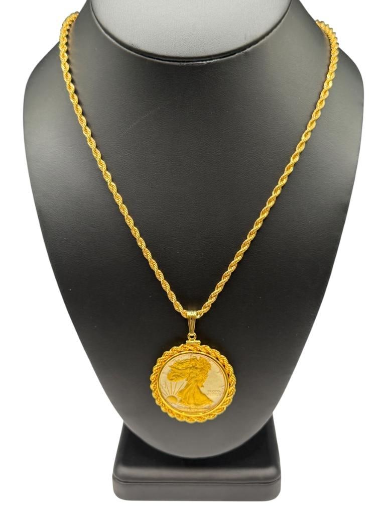 1946 U.S. WALKING LIBERTY SILVER HALF ENCASED AND COATED IN PENDANT ON GOLD FILLED ROPE NECKLACE: COIN IS 90% SILVER 24" NECKLACE, 2" PENDANT