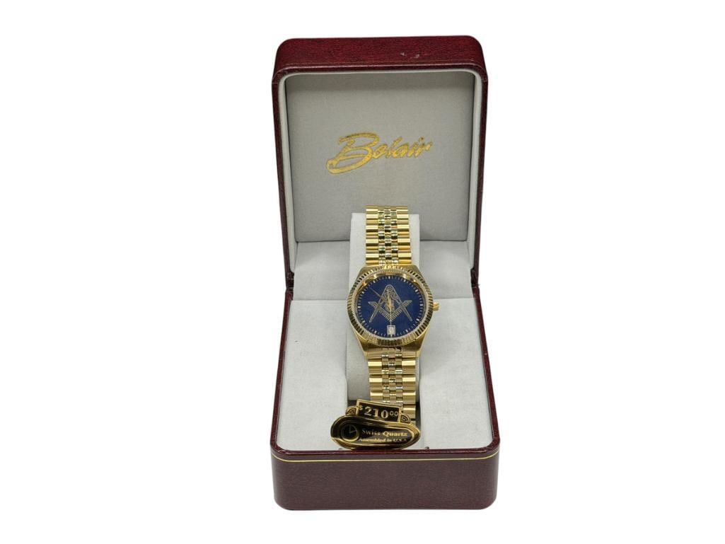 MEN'S BOLAIR MASONIC GOLD TONE STAINLESS STEEL U.S.A. MADE WRISTWATCH MADE FROM SWISS PARTS: INCLUDES ORIGINAL CASE WITH RETAIL PRICE OF $210.00, IN LIKE NEW CONDITION, NEEDS BATTERY, DATE ADJUST 35MM CASE