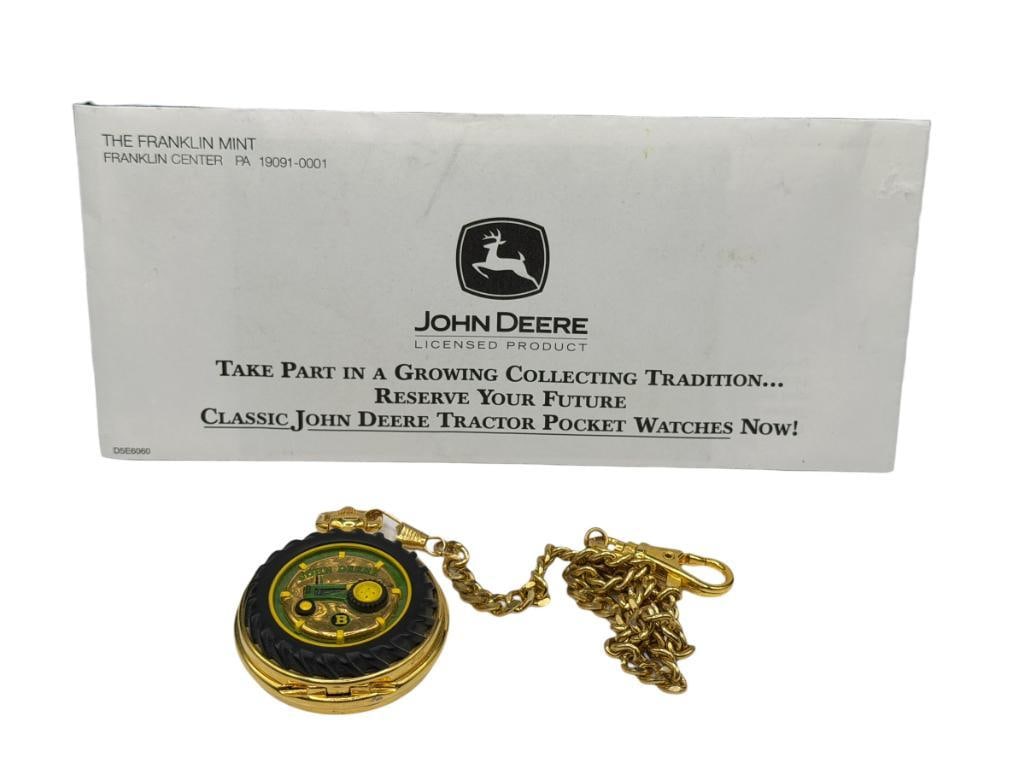 FRANKLIN MINT JOHN DEERE TRACTOR POCKET WATCH: FEATURING GOLD TONE FINISH, UNIQUE TRACTOR DESIGN, AND GOLD TONE WATCH FOB CHAIN, INCLUDES CERTIFICATES AND PAPERWORK, NEEDS BATTERY, LIKE-NEW CONDITION 50MM CASE
