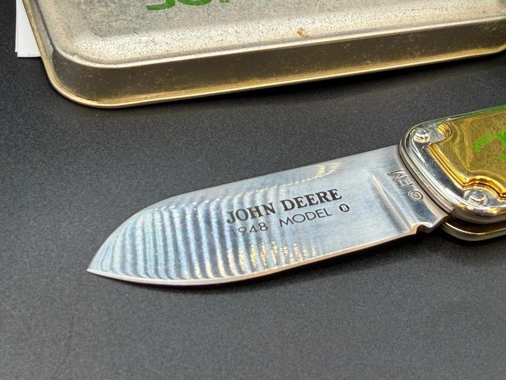 THREE JOHN DEERE TRACTOR THEMED POCKET KNIVES INCLUDING TWO CASE XX DYED BONE HANDLE KNIVES - 12