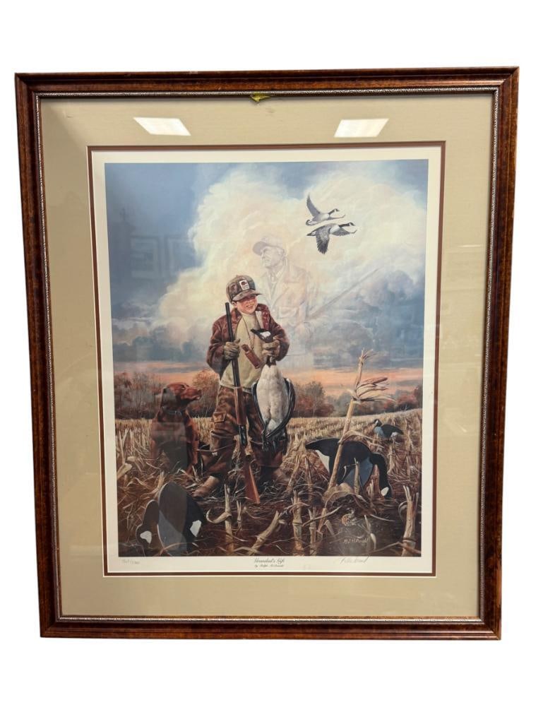 RALPH MCDONALD WILDLIFE ARTIST LIMITED EDITION PRINT TITLED GRANDAD'S GIFT: ART DEPICTS YOUNG BOY HUNTING GEESE WITH GHOSTED SILHOUETTE OF GRANDFATHER IN THE CLOUDS, NO. 1863/5300, SIGNED LOWER RIGHT, FRAMED 26" X 31" FRAME 