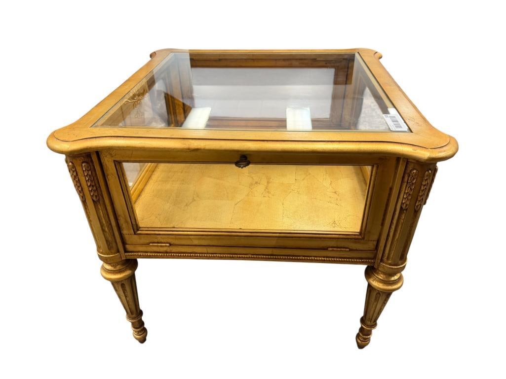 NEOCLASSICAL FRENCH STYLED GLASSTOP DISPLAY ENDTABLE WITH AN ORNATE GILDED FINISH: FEATURES FLUTED TAPERED LEGS 25 1/2" X 25 1/2" X 16"