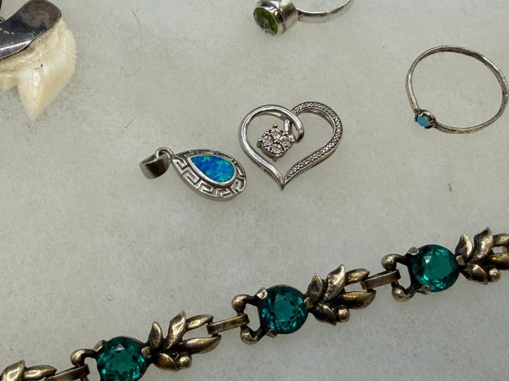 ASSORTED STERLING SILVER JEWELRY FEATURING SIGNED PIECES, RINGS, EARRINGS, AND BRACEELTS - 11