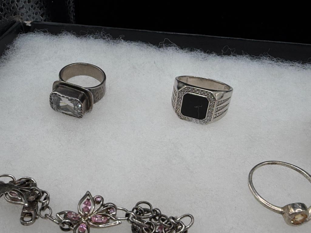 ASSORTED STERLING SILVER JEWELRY FEATURING SIGNED PIECES, RINGS, EARRINGS, AND BRACEELTS - 7