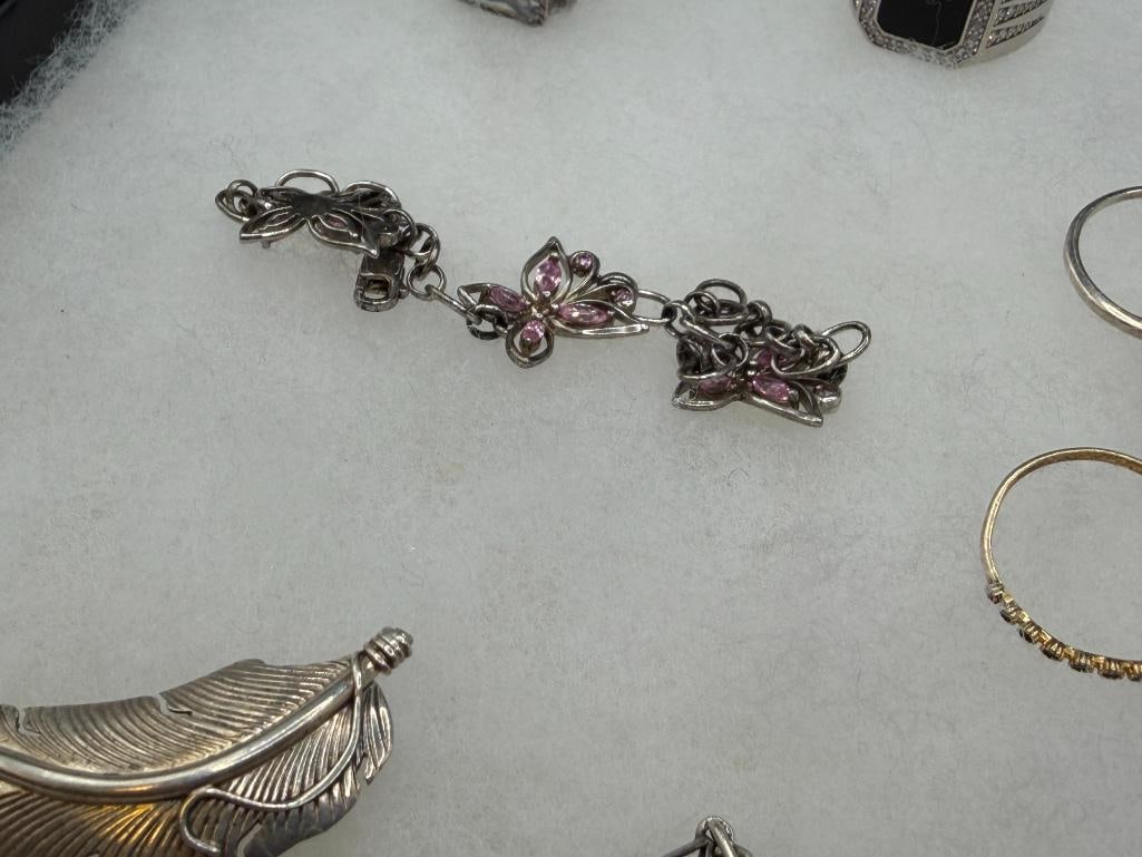 ASSORTED STERLING SILVER JEWELRY FEATURING SIGNED PIECES, RINGS, EARRINGS, AND BRACEELTS - 8