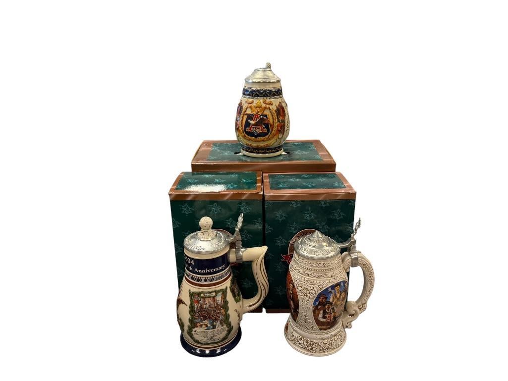 ANHEUSER-BUSCH 1997, 1998, 2004 MEMBERSHIP STEINS: 100TH ANNIVERSARY WORLDS FAIR, OLD WORLD HERITAGE, AND PRIDE AND TRADITION, EACH WITH PEWTER FLIP LIDS AND RELIEF DESIGN, IN MINT CONDITION WITH ORIGINAL BOXES 7 1/2", 9", AND 9 1/2" H