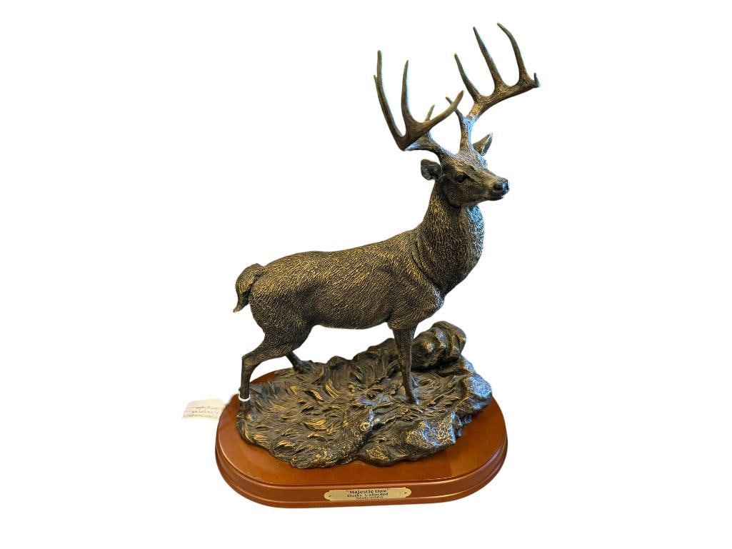DUCKS UNLIMITED LIMITED EDITION BUCK RESIN STATUE / FIGURINE MAJESTIC ONE NO. 3426/4000: BRONZE TONED RESIN SCULPTURE OF A TEN-POINT BUCK STANDING, MOUNTED ON WOODEN BASE WITH BRASS PLAQUE, NO DAMAGE OR REPAIRS 15 1/4" H