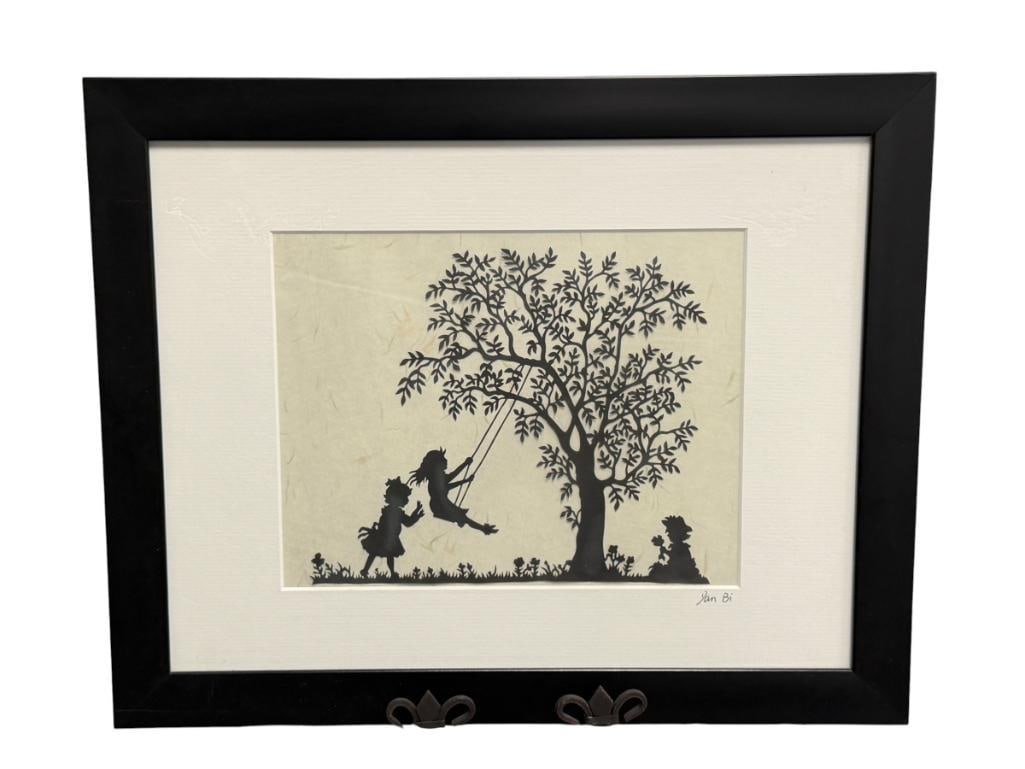 20TH CENTURY CUT WORK / SILHOUETTE SIGNED DAN BI: CUTWORK ILLUSTRATED CHILDREN SWINGING ON A TREE WITH LEAVES AND FLOWERS ON THE GROUND, SIGNED LOWER RIGHT ON THE MATTING, FRAMED 15 3/4" X 12 3/4" FRAME