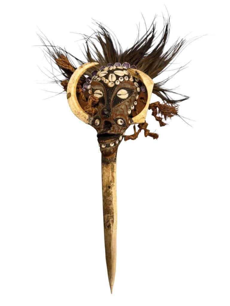 IATMUL SEPIK SMALL CEREMONIAL / RITUAL MASK BONE DAGGER FROM PAPUA NEW GUINEA: BONE DAGGER RITUAL USES IN SEPTIK RIVER REGION, HIGHLY ORNATE DECORATED WITH COWRIE BEADS, INBEDED IN CLAY WITH WARTHOG TUSKS 17" H