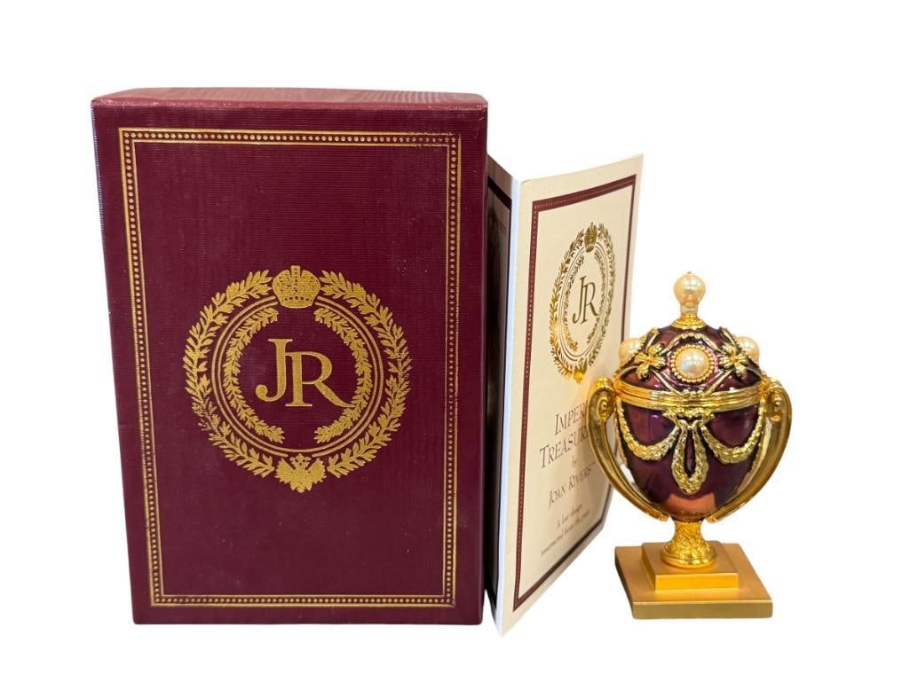 JOAN RIVERS IMPERIAL TREASURES II THE LOST TREASURE EGG WITH FLY PIN: ENAMELED AND BEJEWELED EGG MOUNTED ON STEPPED SQUARE BASE, INCLUDES BEJEWELED FLY PIN, IN MINT CONDITION WITH CERTIFICATE AND ORIGINAL BOX 4 1/4" H