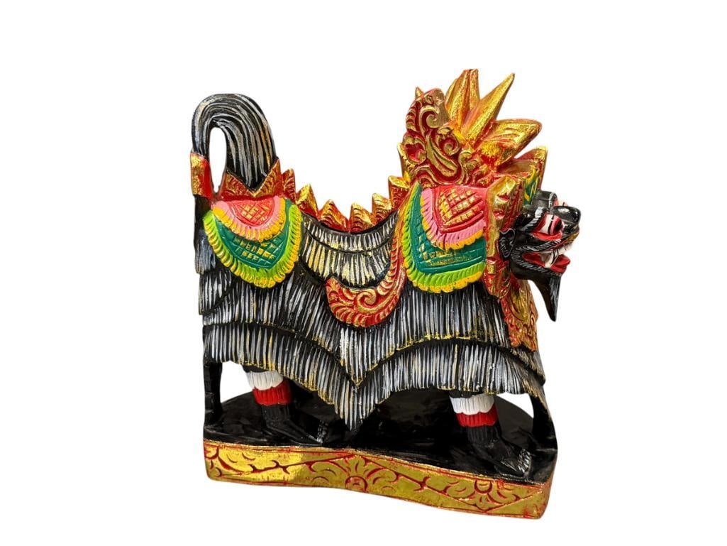 POLYCHROME HAND CARVED WOOD BALINESE MYTHICAL GUARDIAN LION / CREATURE BARONG OR SINGA: CARVED WOOD SCULPTURE FROM INDONESIAN FOLKLORE, VIBRANT COLORS WITH GOLD ACCENTS, SMALL CHIP ON THE POINT OF THE HEADDRESS 9" H