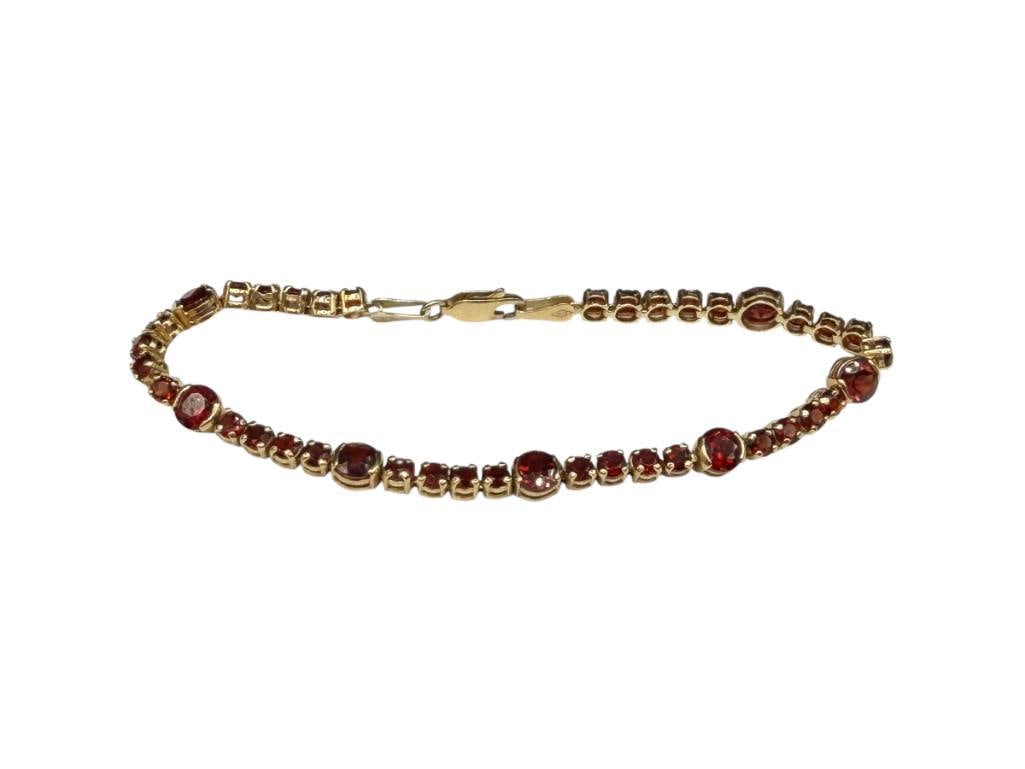 IMPERIAL GOLD COMPANY DESIGNER SIGNED 14K YELLOW GOLD ROUND CUT GARNET TENNIS BRACELET: FEATURING A PATTERN OF A SINGLE ROUND CUT GARNET FOLLOWED BY FIVE SMALLER ROUND GARNETS, DESIGNER HALLMARKED WITH "2/2" DOMINO / DICE 7 1/4" X 3/16", 5MM AND 3MM GARNETS, 6.87 GRAMS 