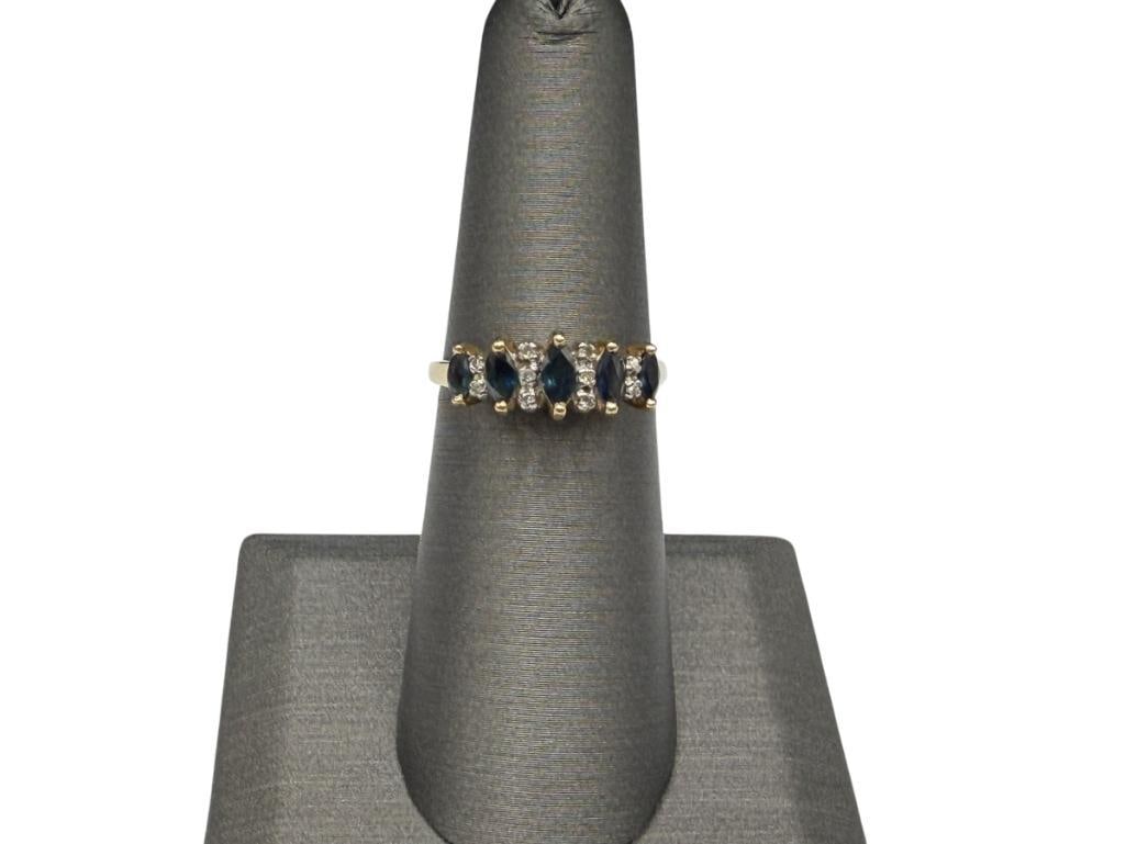 10K YELLOW GOLD MARUIQSE CUT BLUE SAPPHIRE AND DIAMOND RING: FEATURING FIVE MARQUISE CUT BLUE SAPPHIRES AND 10 ROUND BRILLIANT CUT DIAMONDS, DESIGNER HALLMARKED "HDS" SIZE 6 1/4, 1/4" FRONT, UP TO 5MM SAPPHIRES, 1MM DIAMONDS, 2.17 GRAMS