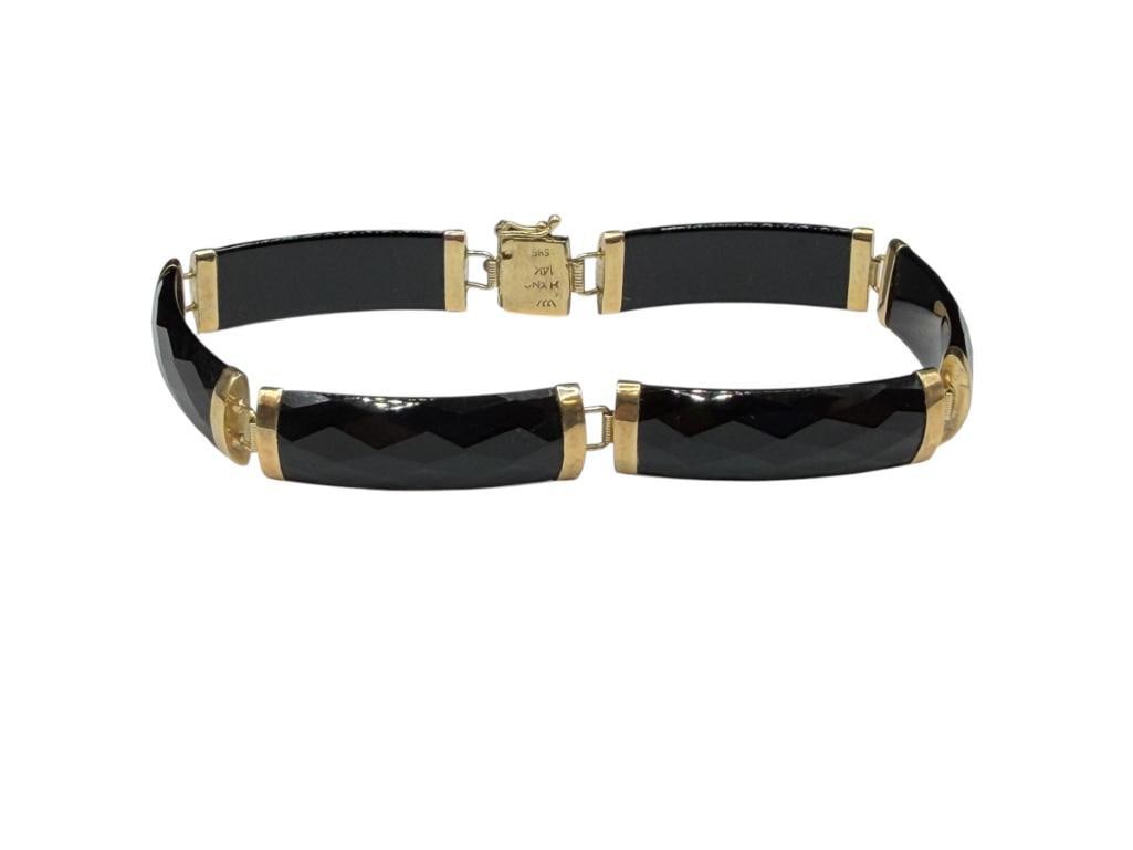 14K YELLOW GOLD FACETED BLACK ONYX LINK BRACELET: DESIGNER HALLMARKED, MADE IN HONG KONG, FEATURING CHINESE "FU" CHARACTER MEANING GOOD FORTUNE ON CLASP 7 3/8" X 3/8", 10.21 GRAMS 